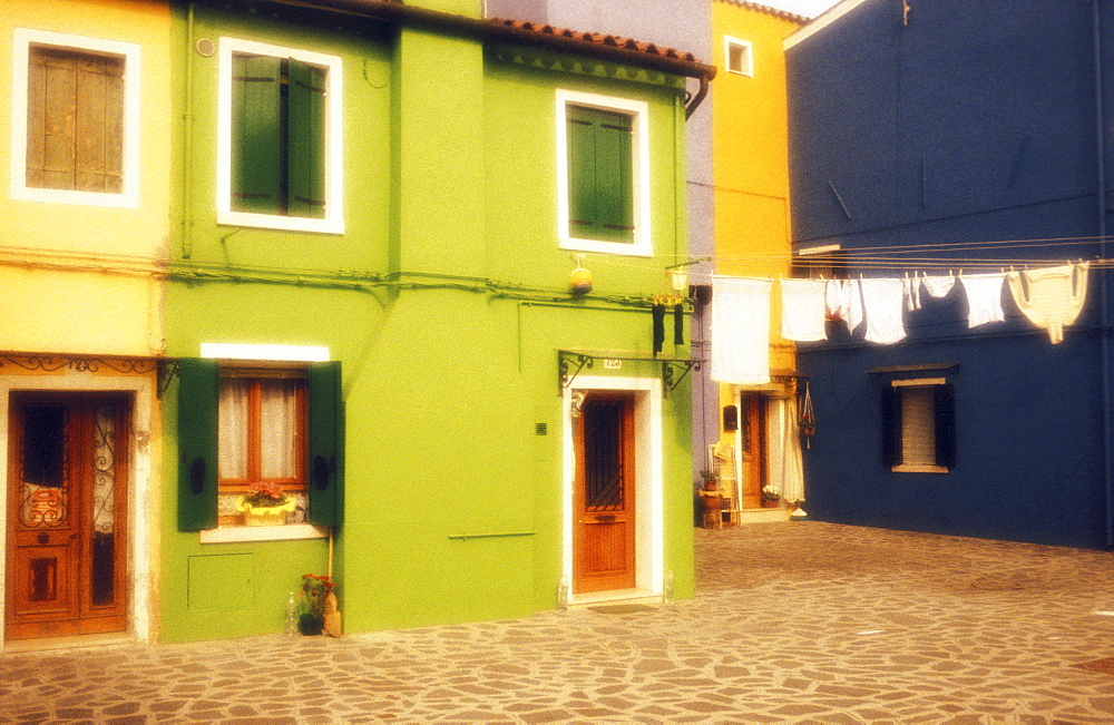 Colorful homes with laundry hanging outside, Island of Burano, Venice, Veneto, Italy, Europe