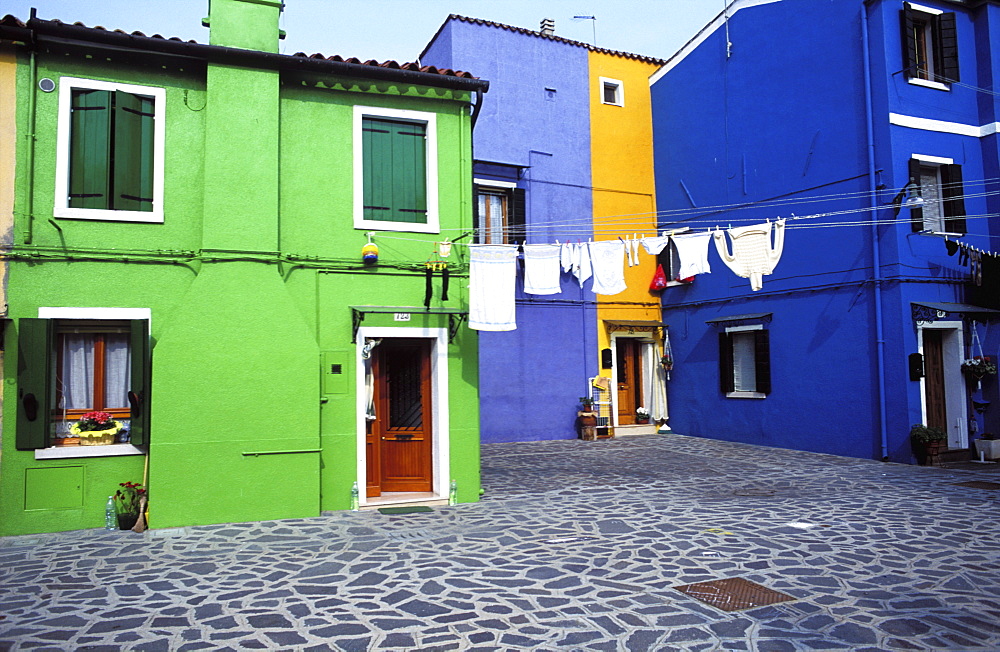 Colorful homes with laundry hanging outside, Island of Burano, Venice, Veneto, Italy, Europe