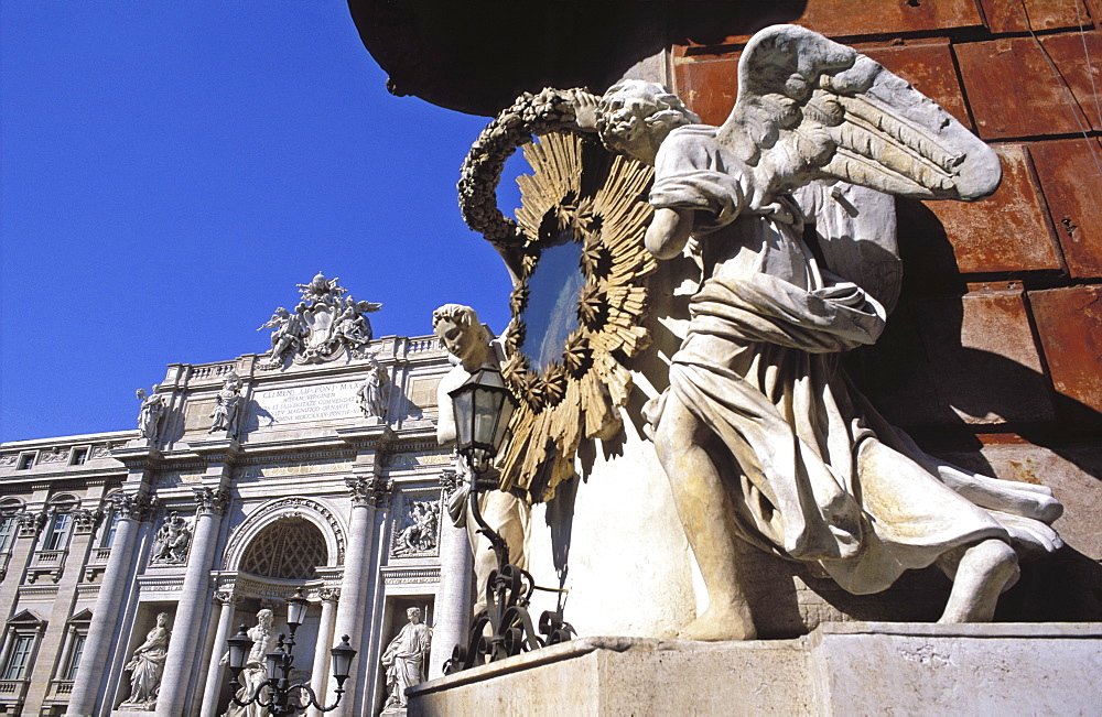 The Trevi Fountain with statue of angels supporting a mirror, Rome, Lazio, Italy, Europe