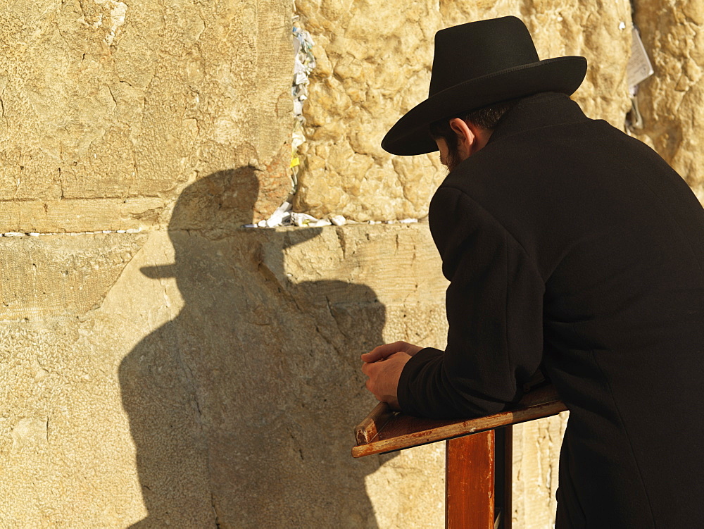 Western Wall (Wailing Wall) with worshipper and prayer slips, Jerusalem, Israel, Middle East