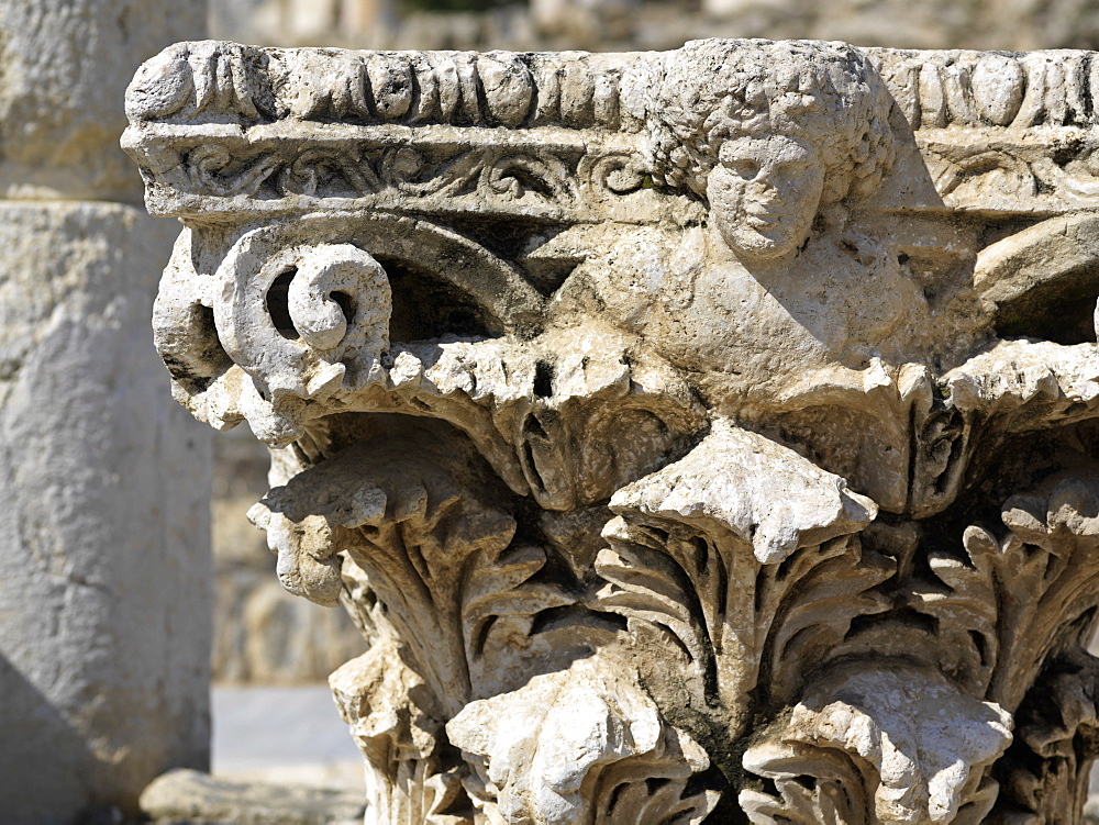 Corinthian capital bearing the head of the god Dionysos, Bet She'an, Israel, Middle East