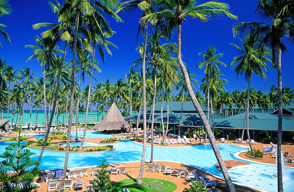 Bavaro Beach Resort, pool area, palm trees and beach with Caribbean Sea, Bavaro Beach, Punta Cana, Dominican Republic, West Indies, Caribbean, Central America