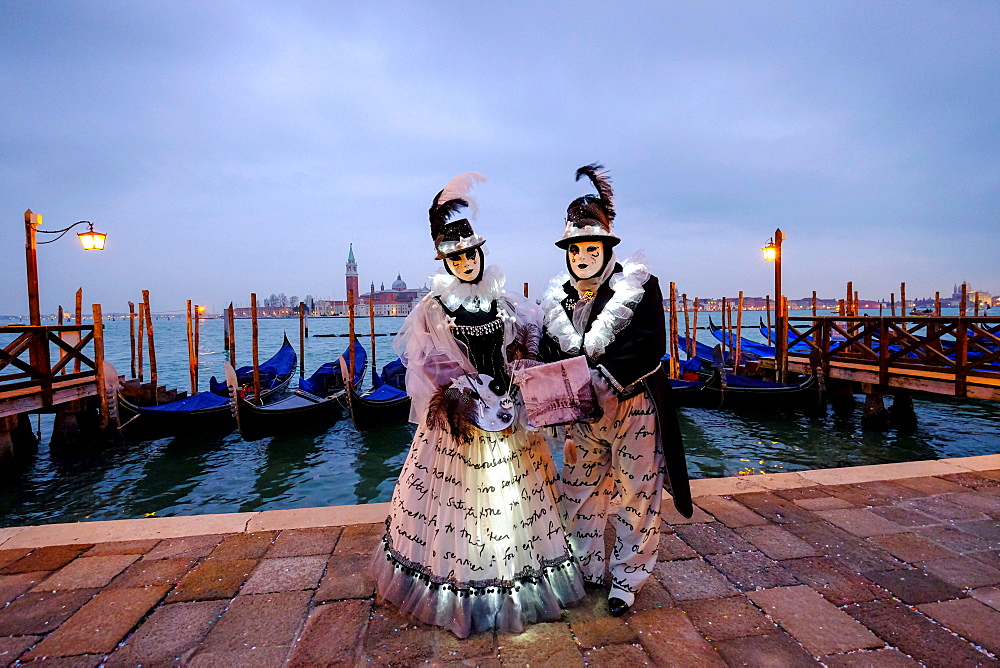 Masks and costumes at St. Mark's Square during Venice Carnival, Venice, Veneto, Italy, Europe