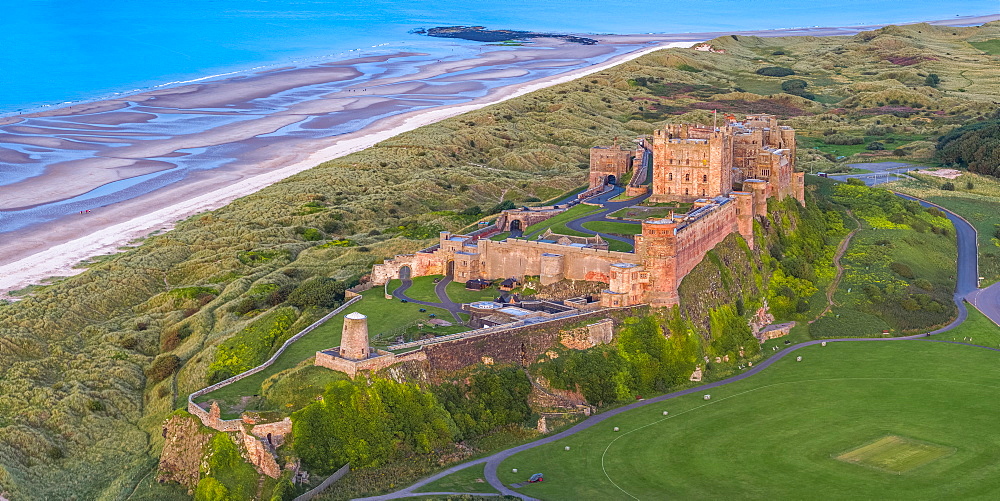 Aerial view by drone of Bamburgh Castle, Bamburgh, Northumberland, England, United Kingdom, Europe