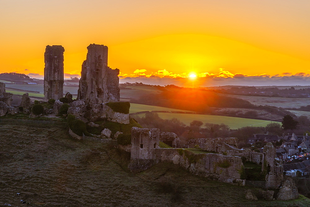 Corfe Castle at sunrise, Dorset, England, United Kingdom, Europe