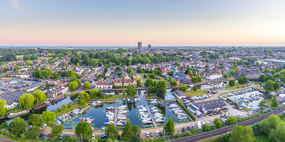 Drone view of Ely Cathedral with Ely Marina and Great Ouse River in foreground, Ely, Cambridgeshire, England, United Kingdom, Europe