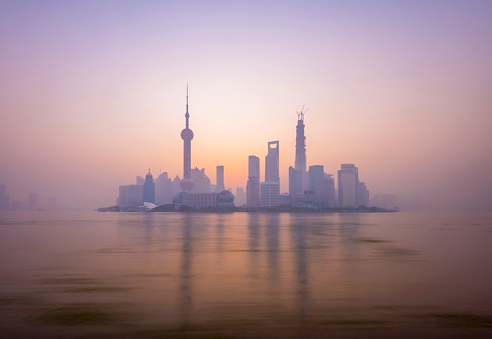 Pudong skyline across Huangpu River, including Oriental Pearl Tower, Shanghai World Financial Center, and Shanghai Tower, Shanghai, China, Asia