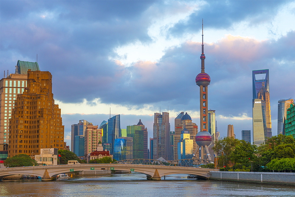 Pudong Financial District skyline, including Oriental Pearl Tower, and bridge over Wusong River (Suzhou Creek), Shanghai, China, Asia 