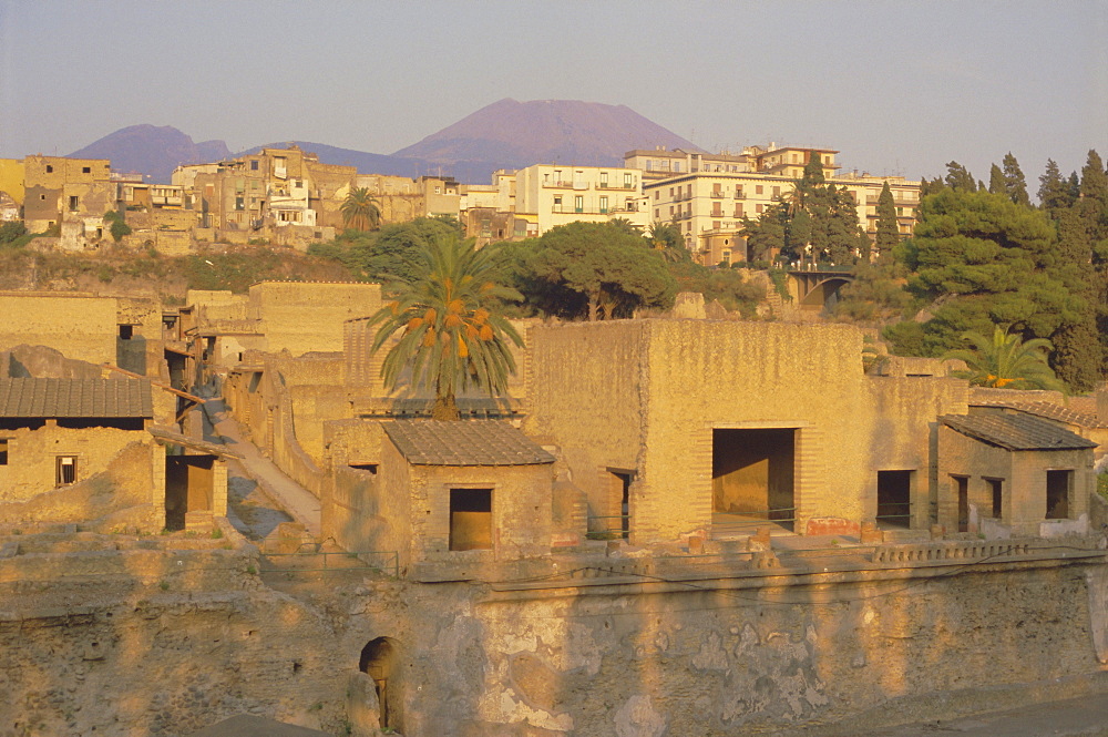 Mount Vesuvius behind the ruins of the Roman resort of Herculaneum, destroyed in the eruption of AD 79 which covered the town in lava and mud, Herculaneum, near Naples, Campania, Italy, Europe