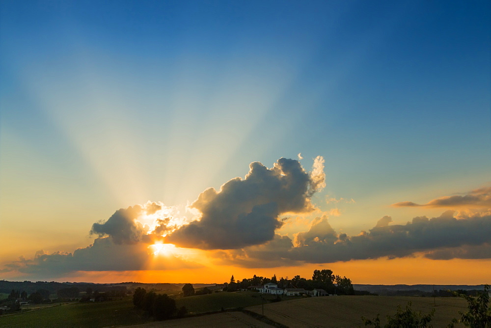 View westwards at sunset from this quiet hilltop village near Duras, Levignac-de-Guyenne, Lot-et-Garonne, Aquitaine, France, Europe