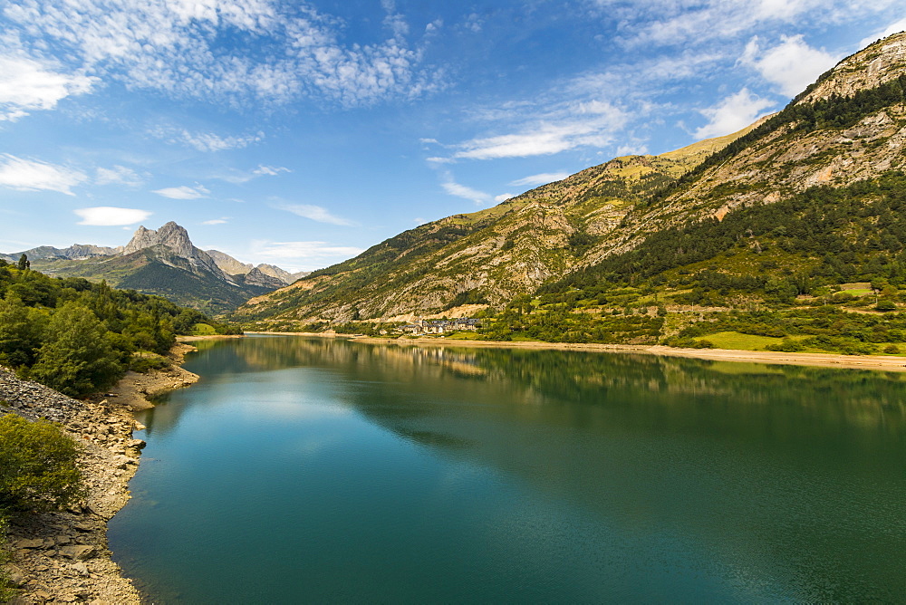 Lanuza lake and village and Pena Foratata peak in the scenic upper Tena Valley, Sallent de Gallego, Pyrenees, Huesca Province, Spain, Europe