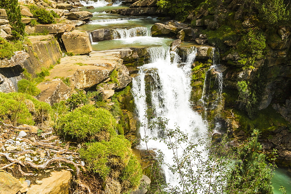 Steps of limestone strata make a waterfall on the Rio Arazas, upper Ordesa Valley, Ordesa National Park, Pyrenees, Aragon, Spain, Europe