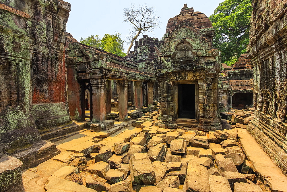 Gopura entrance and weathered carved sandstone walls in the 12th century Preah Khan (Prah Khan) Buddhist temple complex, Angkor, UNESCO World Heritage Site, Siem Reap, Cambodia, Indochina, Southeast Asia, Asia