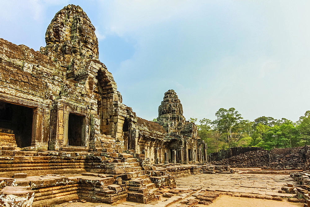 West inner gallery towers and four of the 216 carved faces at Bayon temple in Angkor Thom walled city, Angkor, UNESCO World Heritage Site, Siem Reap, Cambodia, Indochina, Southeast Asia, Asia