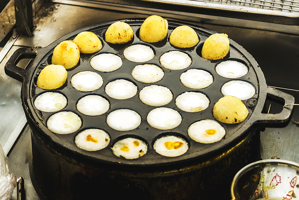 Sticky rice balls cooking in the Psar Chas Old Market in centre of this important north west tourist town, Siem Reap, Cambodia, Indochina, Southeast Asia, Asia