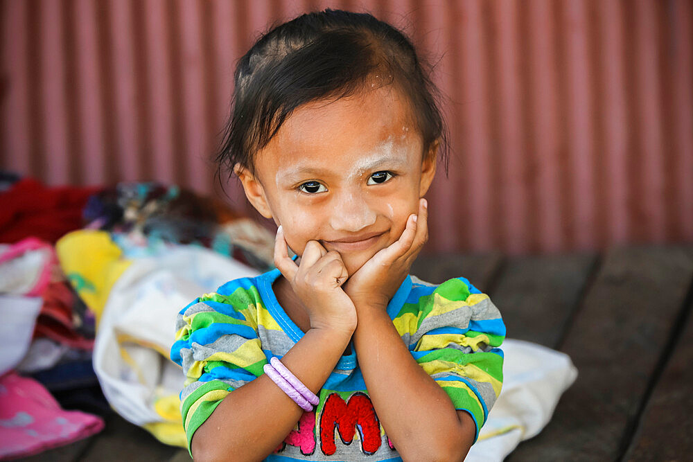 Smiling young girl at a village in karst limestone region, Rammang-Rammang, Maros, South Sulawesi, Indonesia, Southeast Asia, Asia