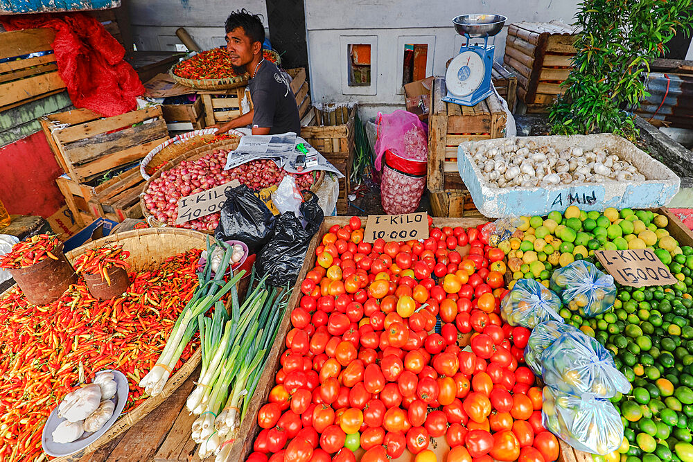 Chilis, tomatoes, limes & garlic at market stall in the capital. Ulu, Siau Island, Sangihe Archipelago, Nth Sulawesi, Indonesia