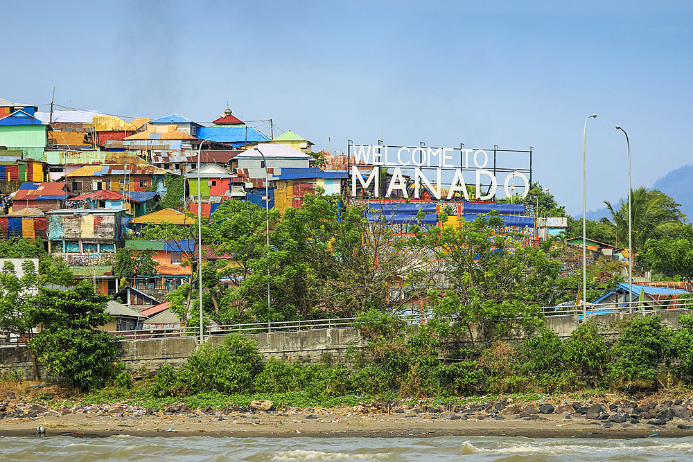 Welcome to Manado sign at the port entrance of provincial capital in Sulawesi's north, Manado, North Sulawesi, Indonesia, Southeast Asia, Asia