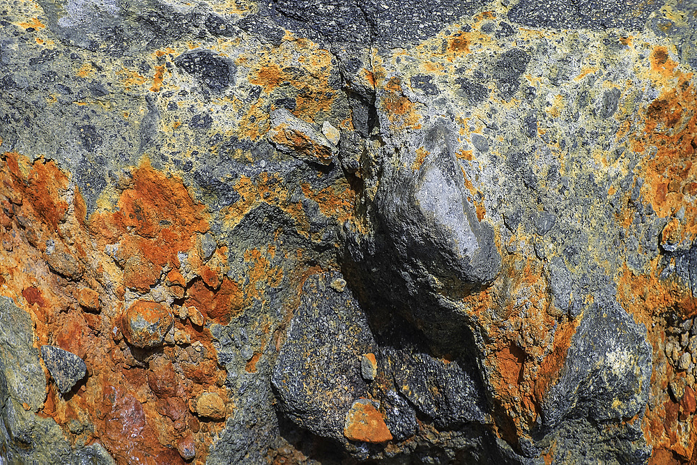 Sulphur deposits in a piece of lava rock on the slopes of Mount Lokon volcano near Tomohon city, Gunung Lokon, Tomohon, North Sulawesi, Indonesia, Southeast Asia, Asia