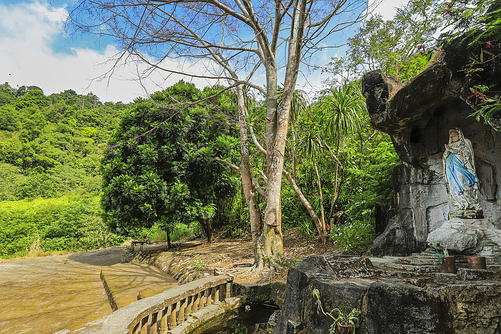 Statue of the Madonna in a grotto at this volcanic tourist park with a peace tower and worship houses of five major religions, Bukit Kasih, Minahasa, North Sulawesi, Indonesia, Southeast Asia, Asia