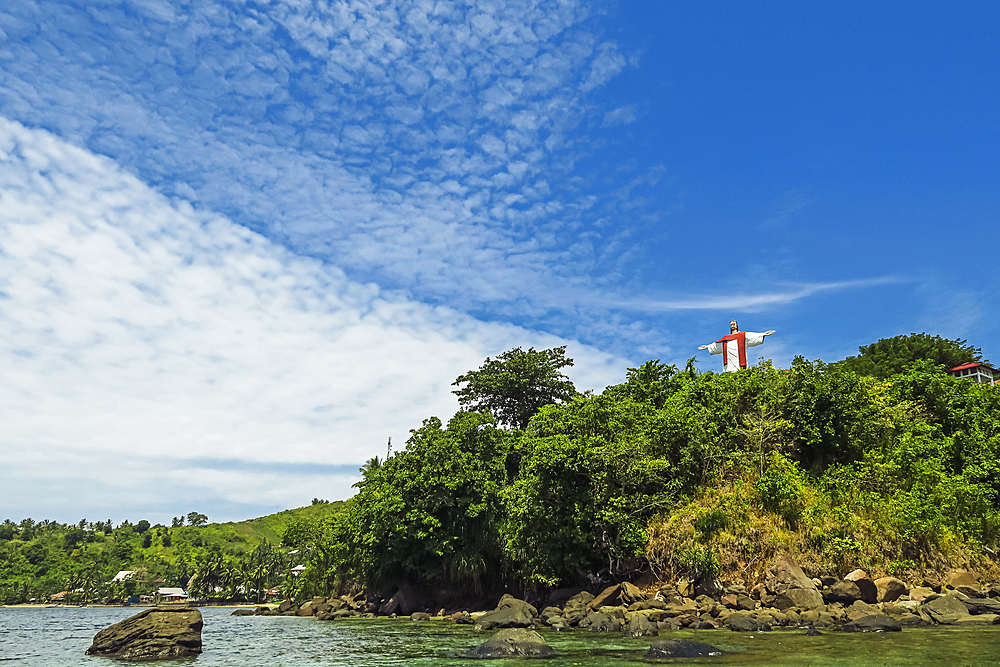 Large statue of Jesus Christ with arms outstretched at Taman Balirangeng on the south east coast of Siau Island, Siau, Sangihe Islands, North Sulawesi, Indonesia, Southeast Asia, Asia