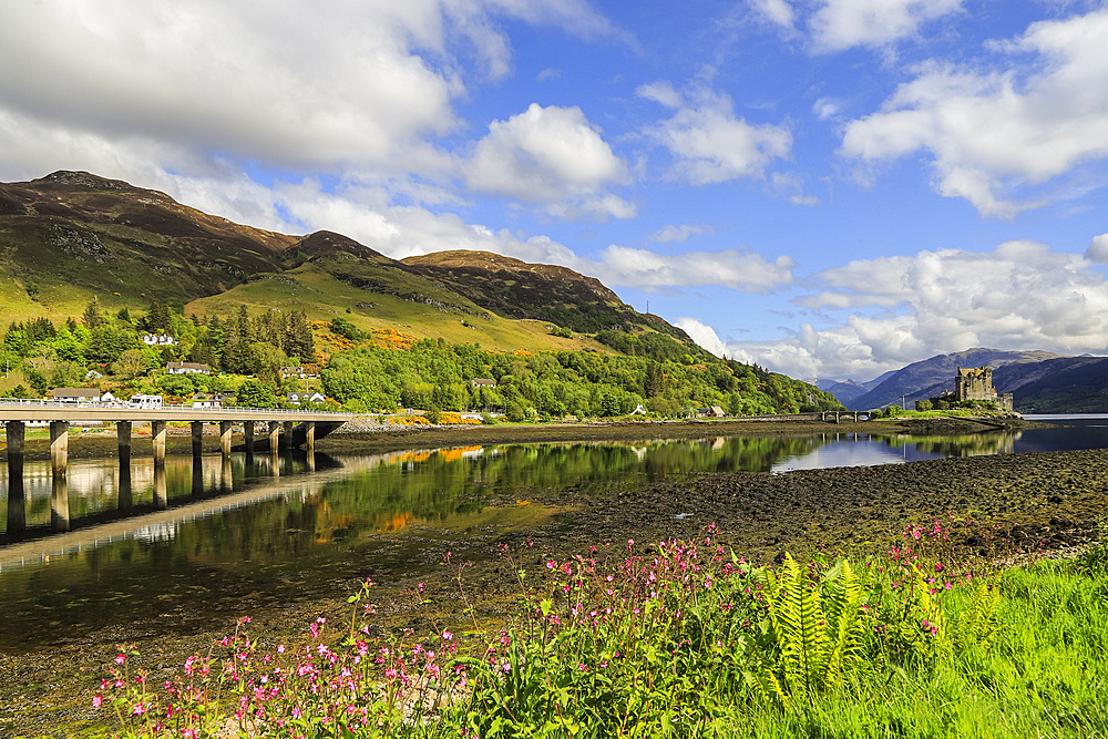 Loch Long with the A87 road bridge and 13th century Eilean Donan Castle beyond, Eilean Donan, Dornie, Kyle of Loch Alsh, West Highlands, Scotland, United Kingdom, Europe