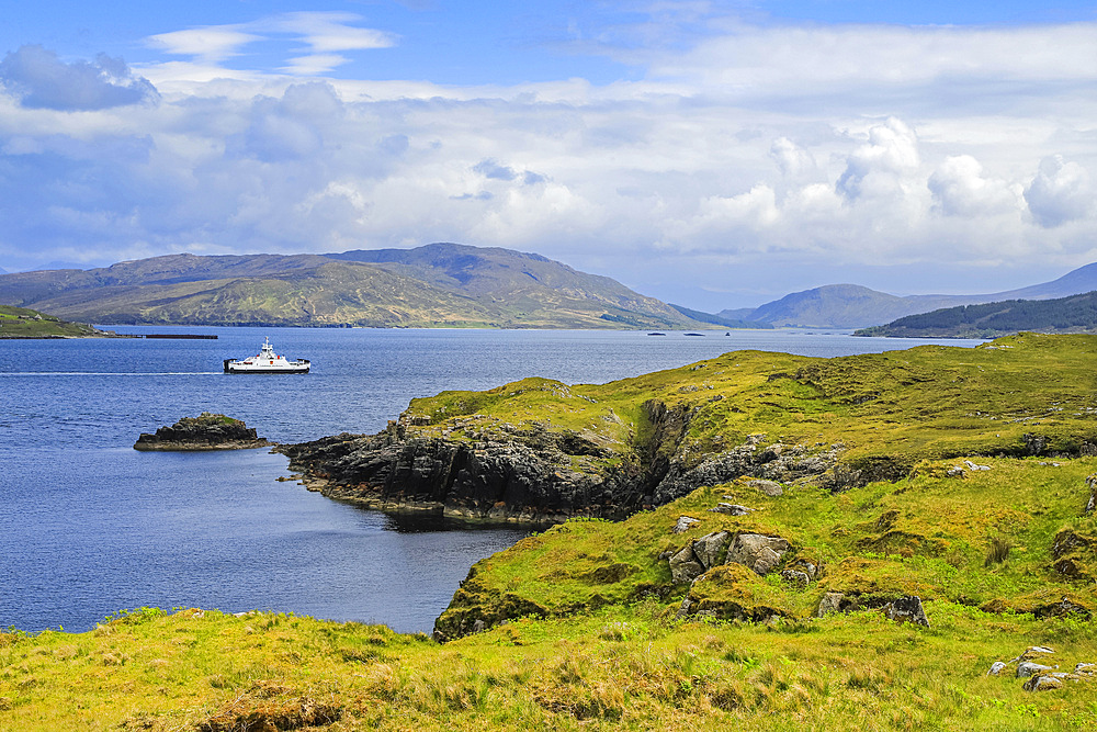 View South across Balmeanach Bay from Braes peninsula to Isle of Scalpay with the Calmac ferry crossing from Raasay Island to Sconser on Skye, The Braes, Portree, Skye, Inner Hebrides, Scotland, United Kingdom, Europe