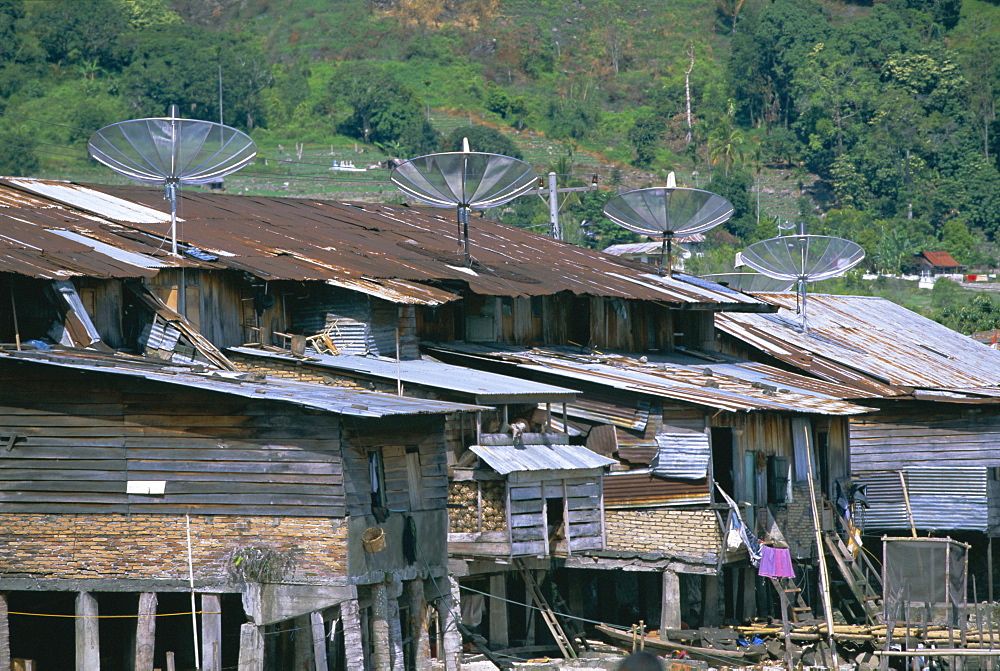 Stilt houses with satellite dishes, Haranggaol, north shore of Lake Toba, North Sumatra, Sumatra, Indonesia, Southeast Asia, Asia