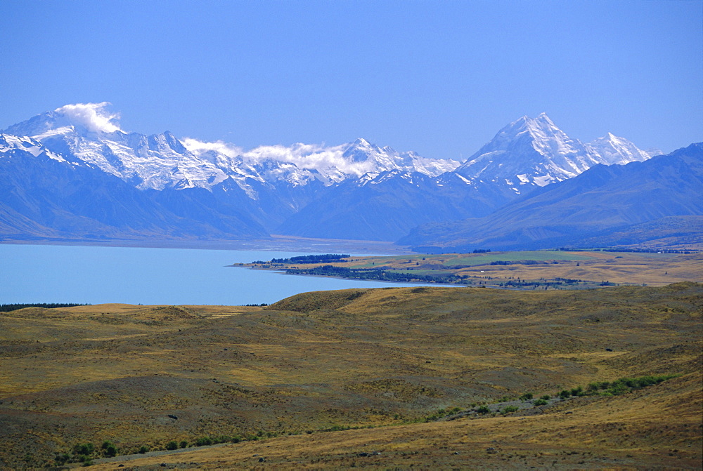 Looking north along Lake Pukaki towards the Southern Alps, with Mt Sefton, left, and Mt Cook, right; (glacial sediment causes the blue of many NZ lakes), Canterbury, South Island, New Zealand