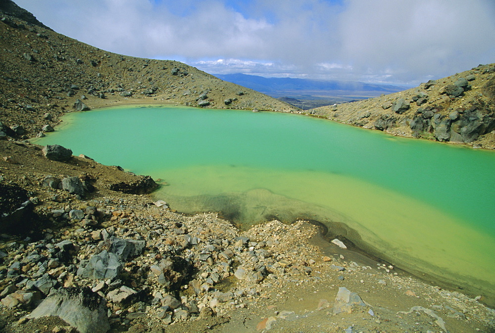 One of the Emerald Lakes, explosion craters filled with mineral-tinted water, on Mount Tongariro in the Tongariro National Park on the central plateau, North Island, New Zealand