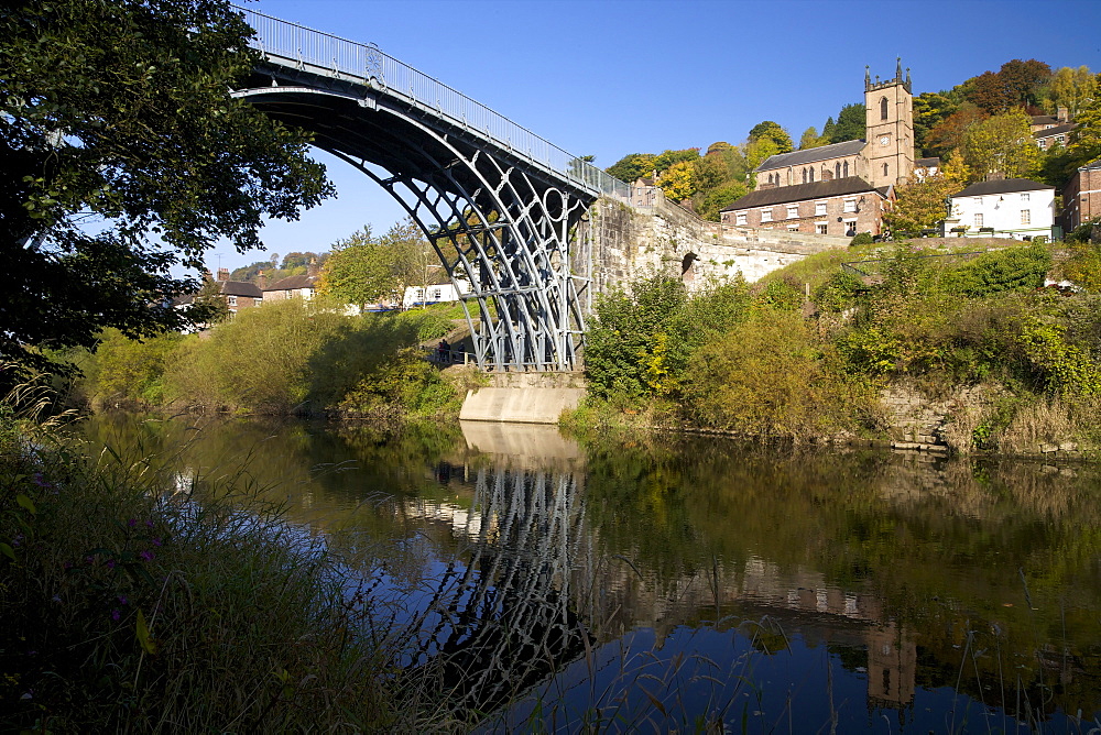 Worlds first iron bridge spans the banks of the River Severn in autumn sunshine, Ironbridge, UNESCO World Heritage Site, Shropshire, England, United Kingdom, Europe