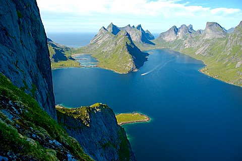 Big rock of Navaren and rough mountains with fjord Kjerkfjorden Moskenesoya Lofoten Norway