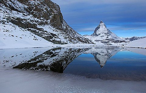 Matterhorn reflected in the Riffelsee, Zermatt, Valais, Switzerland