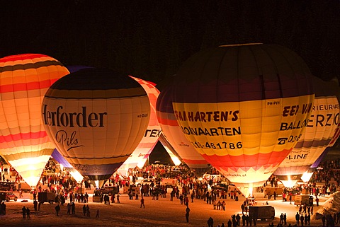 Hot air balloons glowing against a night sky, Filzmoos, Salzburg, Austria, Europe