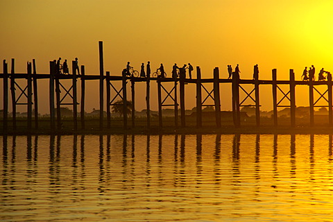 U Bein Bridge in orange evening light Amarapura Mandalay Burma