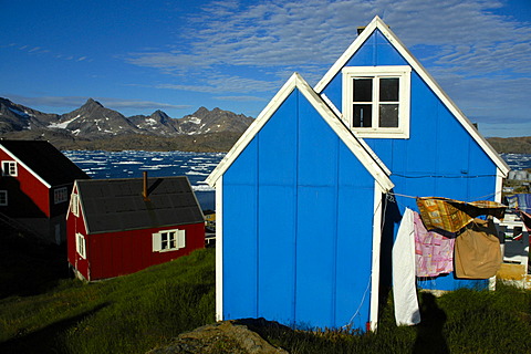 Blue and red wooden house in settlement Ammassalik Eastgreenland