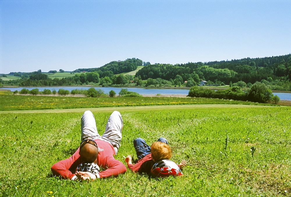 Near Thanning south of Munich Upper Bavaria Germany resting near a lake