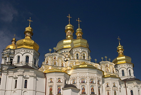 Ukraine Kiev the monastery of cave Kyjevo PecersÂ´ka Lavra view to UspensÂ´kyj Cathedral with 7 golden domes crosses are shining in blue sky 2004