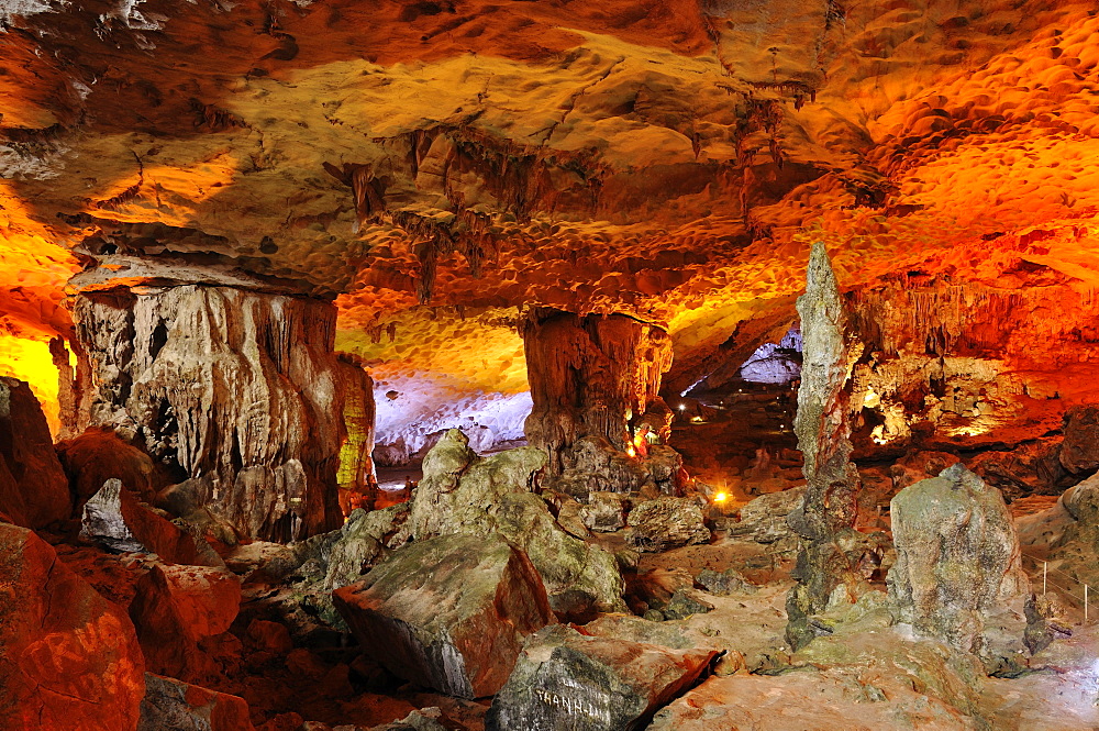 Colourfully, illuminated Hang Sung Sot cave, Surprise Cave, Cave of Awe, a UNESCO World Heritage Site, stalactite cave in Halong Bay, Vietnam, Southeast Asia, Asia