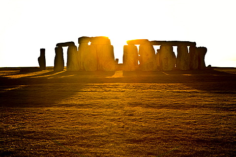 Stonehenge in front of the setting sun, Wessex, England, Great Britain, Europe