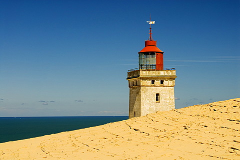 Lighthouse buried by a shifting sand dune at Rubjerg near Loekken, Jutland, Denmark