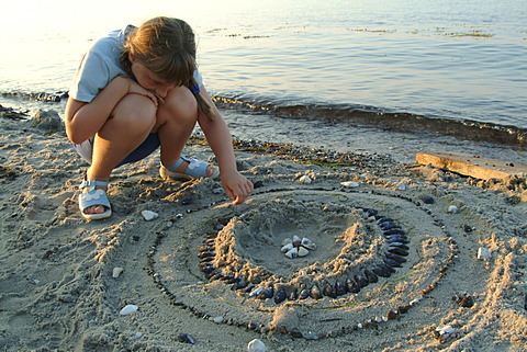 Child plays at the beach