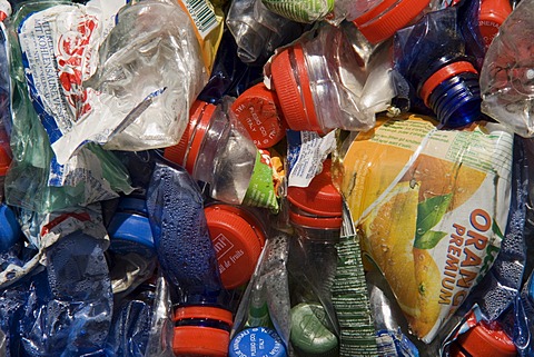 Plastic bottles, compressed into a large bale and ready for recycling