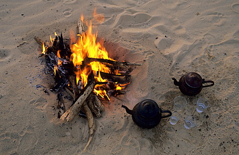 Arabian tea pot near campfire, Libya