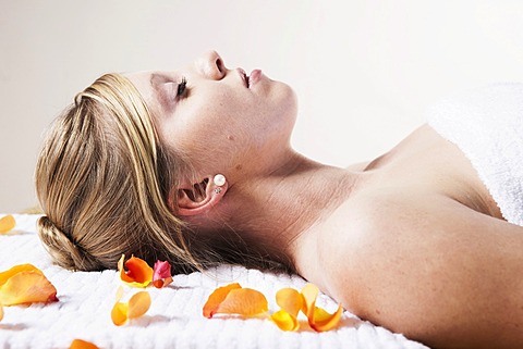 Young woman relaxing while lying on her back