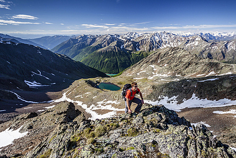 Mountaineer during the ascent of Mt Grawand , Ortler Alps at the back, Val Senales below with the Vernagt Reservoir, Meraner Land area, Merano, Meran region, South Tyrol, Italy, Europe