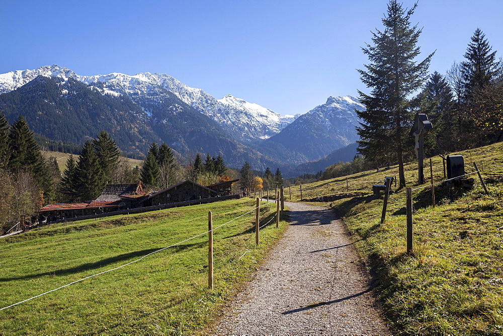 Dirt road and Kutschenmuseum Hinterstein carriage museum, behind the AllgÃ¤u Alps, Hinterstein, AllgÃ¤u, Bavaria, Germany, Europe