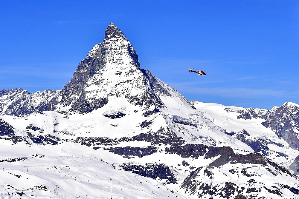 Matterhorn and helicopter from Gornergart, Zermatt, Switzerland, Europe