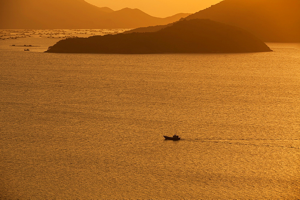 Fishing boat at sea, sunset, Nha Trang Bay, Hong Ong Island, South China Sea, Vietnam, Asia