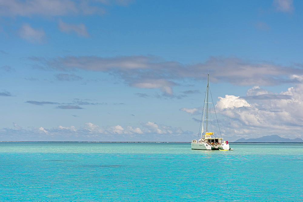 Catamaran in turquoise lagoon, Raiatea, South Pacific, French Polynesia, Oceania